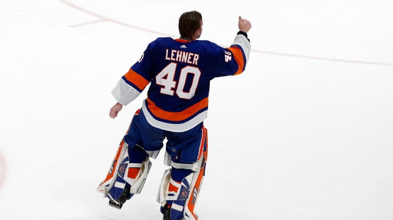 Robin Lehner #40 of the New York Islanders celebrates after...