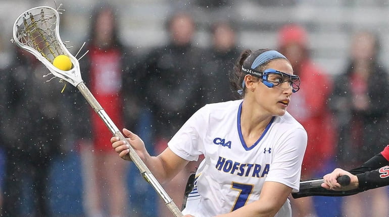 Hofstra's Alyssa Parrella (7) moves the ball while being covered...