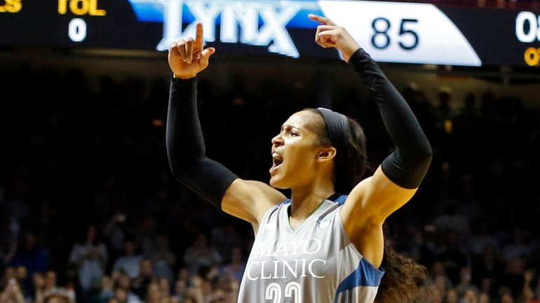Minnesota Lynx's Maya Moore cheers on the crowd in the...