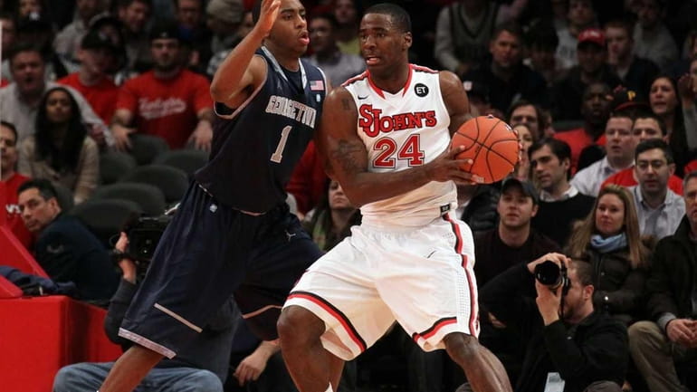 Hollis Thompson of the Georgetown Hoyas defends Justin Burrell of...