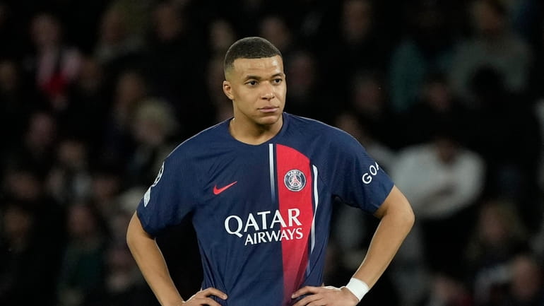 PSG's Kylian Mbappe gestures during the Champions League quarterfinal first...