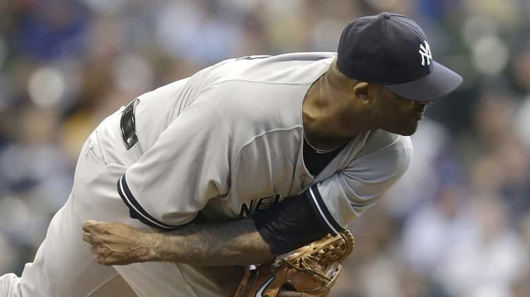 CC Sabathia of the Yankees pitches in the bottom of...