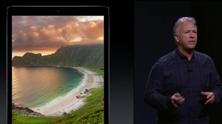 Phil Schiller touts the features and size of the iPad...