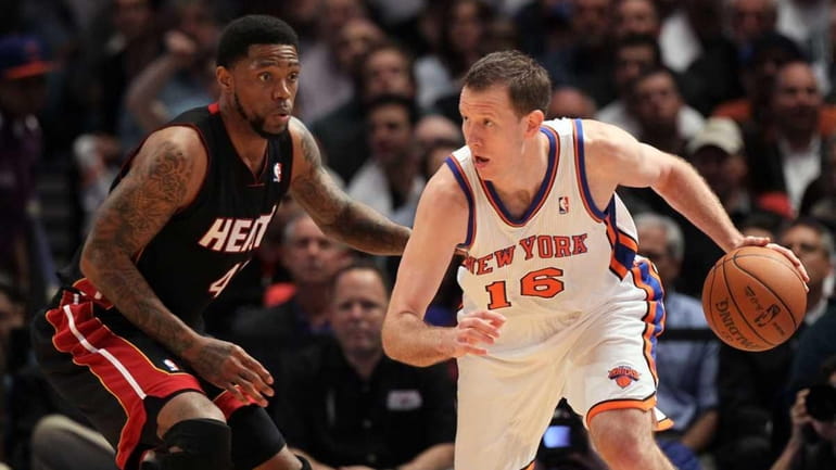Steve Novak in action against Udonis Haslem of the Miami...