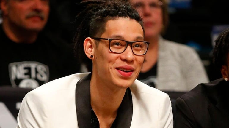 Jeremy Lin of the Nets looks on from the bench...