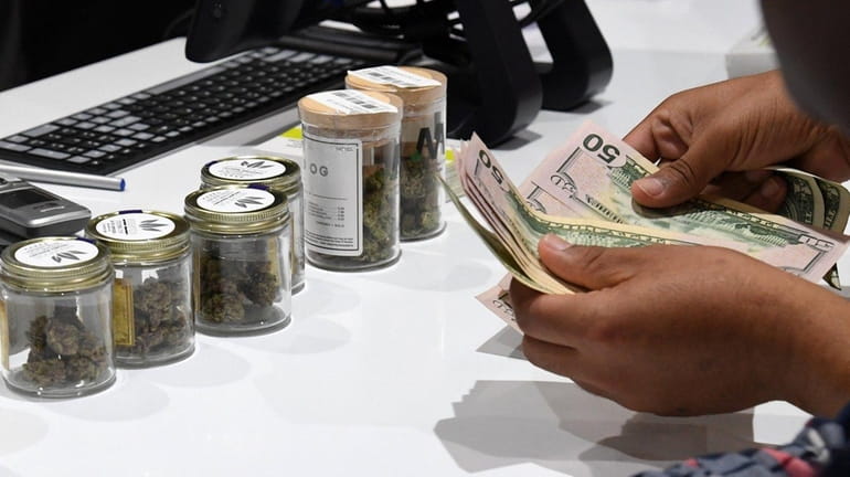 A customer pays for cannabis products.