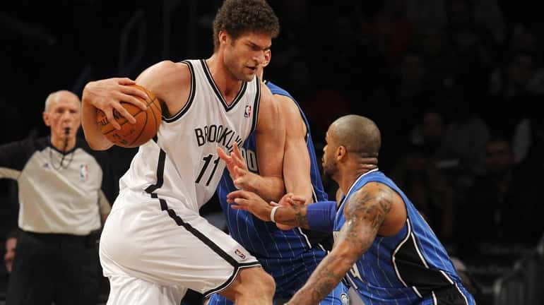 Brook Lopez drives against Jameer Nelson of the Orlando Magic....