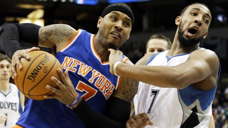 Carmelo Anthony drives around Minnesota Timberwolves' Derrick Williams in the...