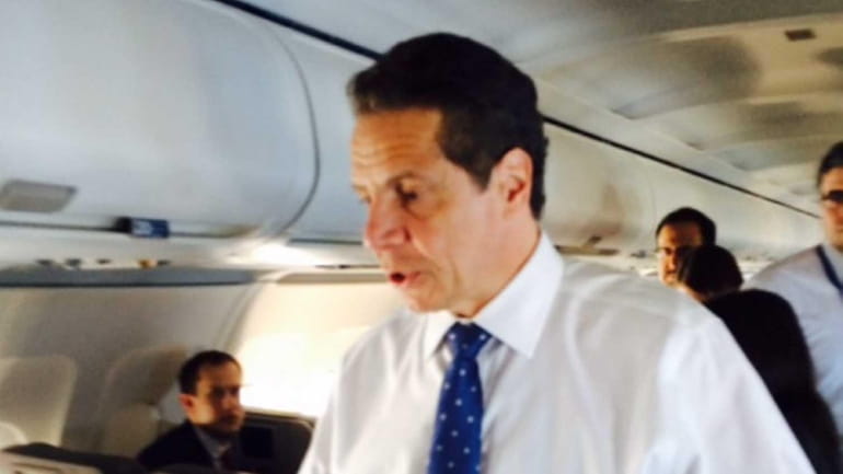 Gov. Andrew Cuomo on the plane as he flys to...