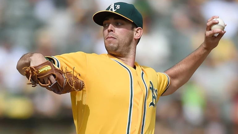 Sean Nolin of the Oakland Athletics pitches against the San...