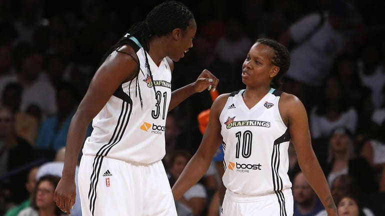New York Liberty's Tina Charles and Epiphanny Prince celebrate after...
