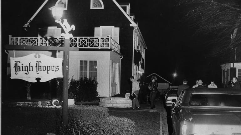 Police investigate at the "Amityville Horror" house on Ocean Avenue...