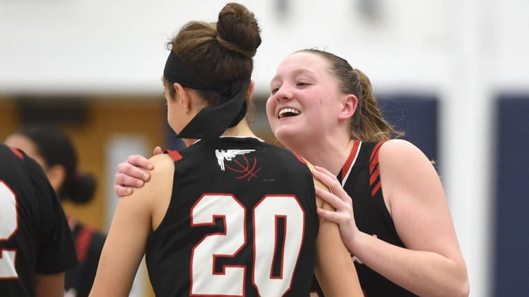 Jolie Boyle of Half Hollow Hills East, right, celebrates with...