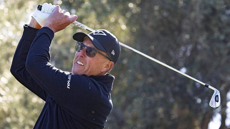 Captain Phil Mickelson, of HyFlyers GC, hits from the 12th...