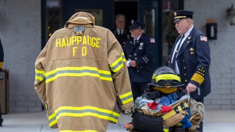 The gear of former Hauppauge Fire Chief Stephen A. Feron outside Maloney Funeral Home...