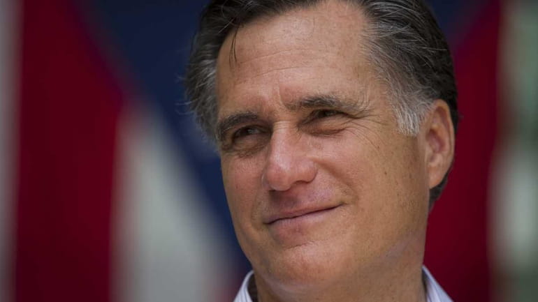 Republican presidential candidate, former Massachusetts Gov. Mitt Romney pauses during...