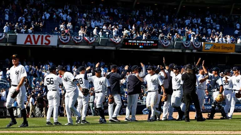 The New York Yankees celebrate their Opening Day victory against...