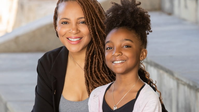 TaKiyah Wallace-McMillian, left, and her daughter, Charlie, 12. Wallace-McMillian founded...