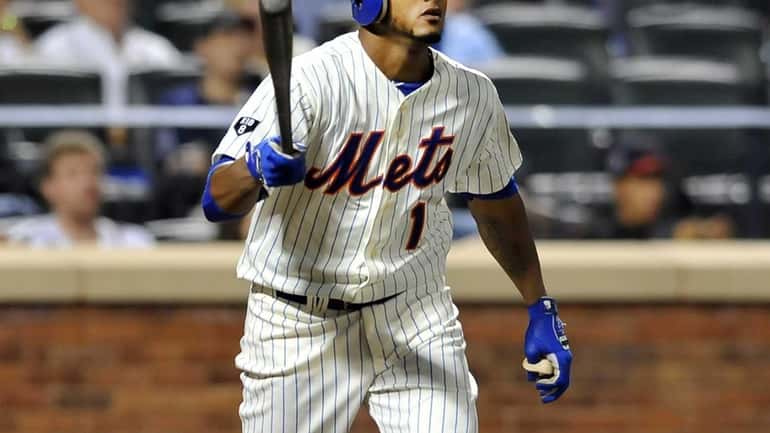 Jordany Valdespin follows the flight of his sixth-inning solo home...