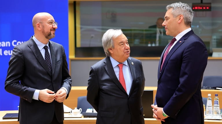 United Nations Secretary General Antonio Guterres, center, speaks with European...