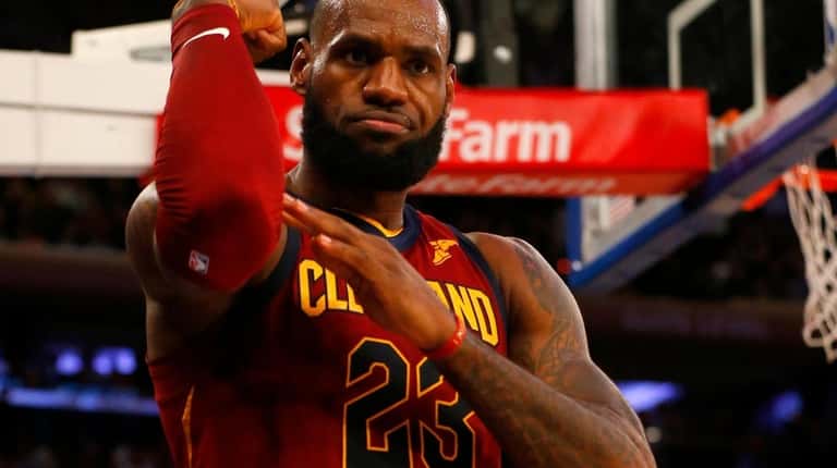 The Cavaliers' LeBron James reacts after a basket in the second...