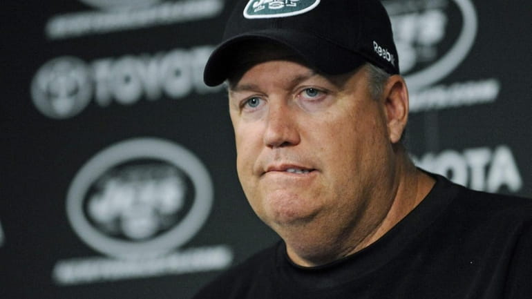Jets head coach Rex Ryan listens to a question from...