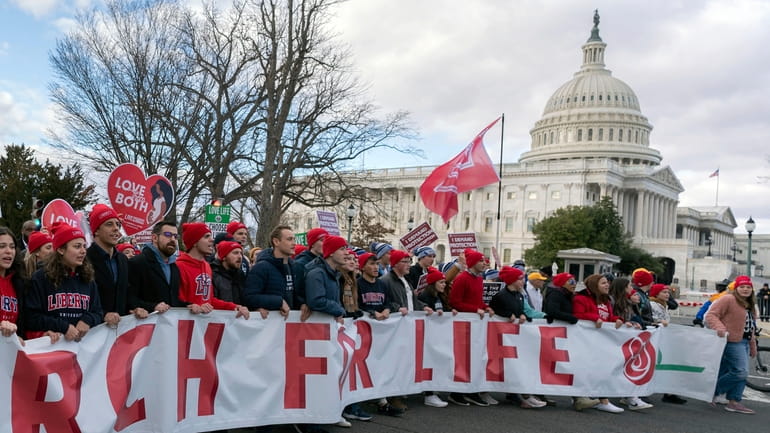 Anti-abortion activists march outside of the U.S. Capitol during the...