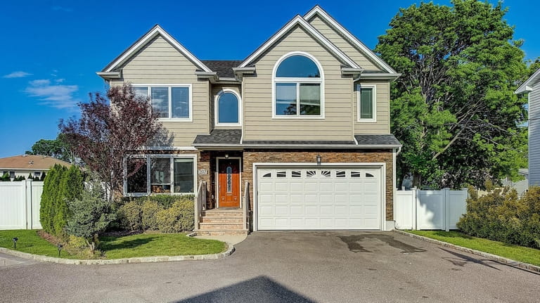 Priced at $879,000, this four-bedroom two-bathroom Colonial at Roslyn Place...