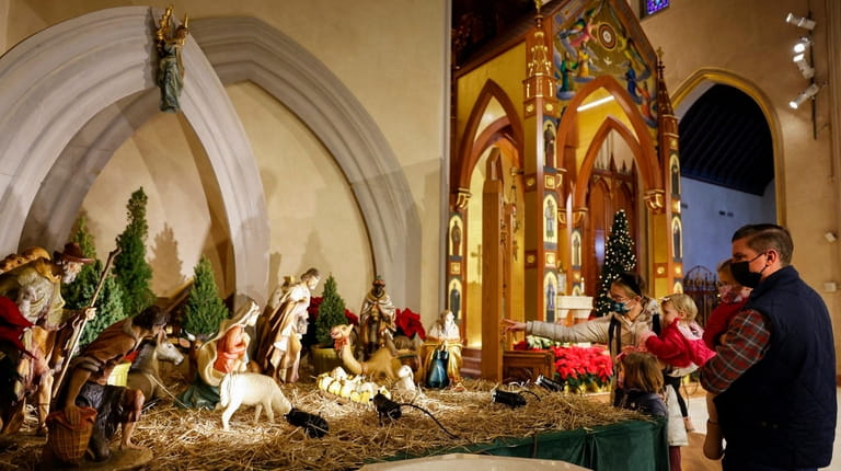 Parishioners celebrate Christmas Day at St. Agnes Church in Rockville Centre on...