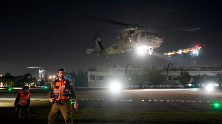 An Israeli Air Force helicopter carrying an Israeli hostage released...