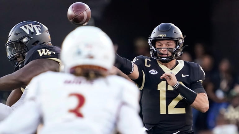 Wake Forest quarterback Mitch Griffis (12) throws a pass against...