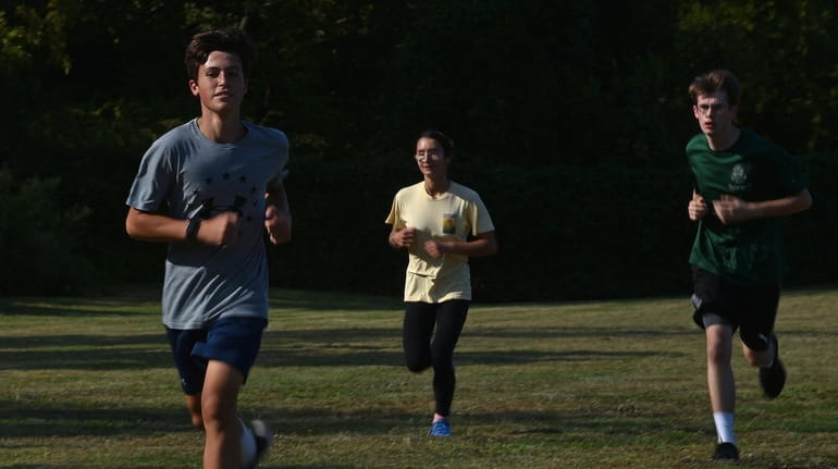 Michael Skillmore, St. Dominic sophomore, runs during the school's first...