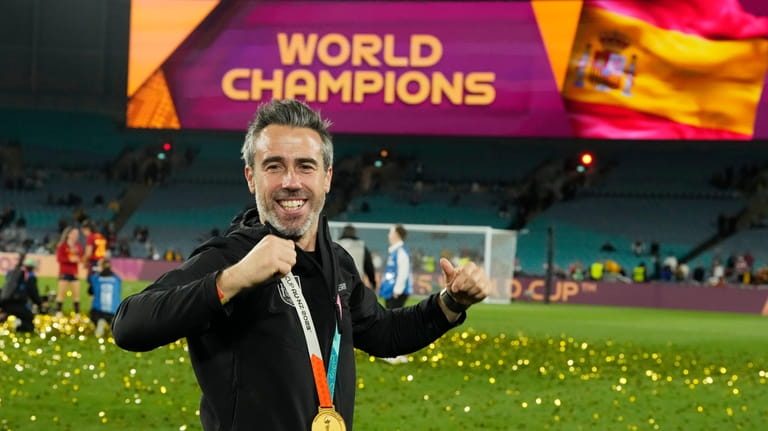 Spain's head coach Jorge Vilda celebrates with the gold medal...