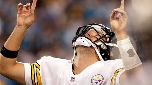 The Pittsburgh Steelers' Ben Roethlisberger gestures after throwing a touchdown...