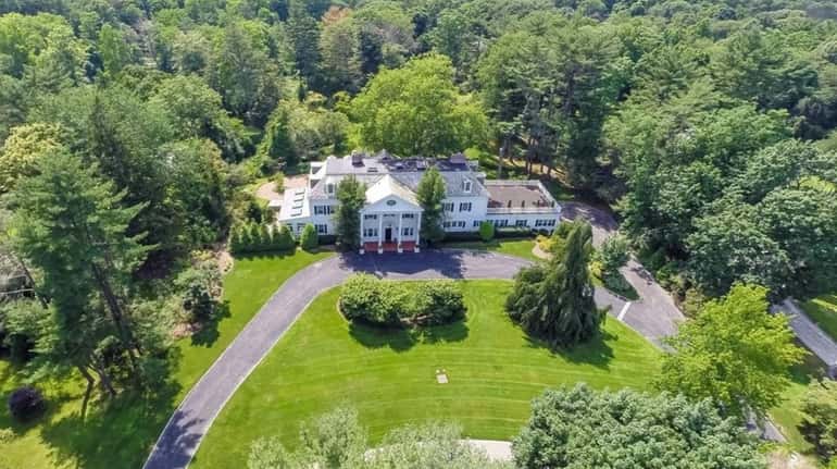 This 10,000-square-foot Old Westbury Colonial manor on Forte Drive was once owned...