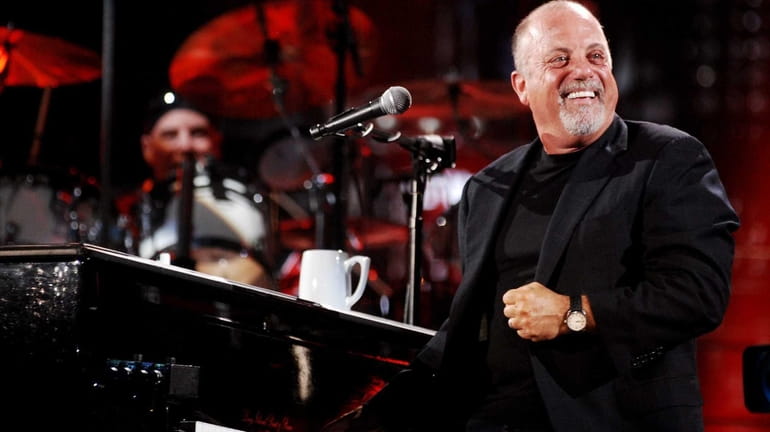 Billy Joel performs at Shea Stadium.