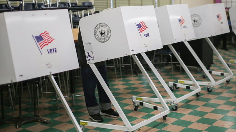 Voting booths at West Babylon Junior High School on Nov. 3,...