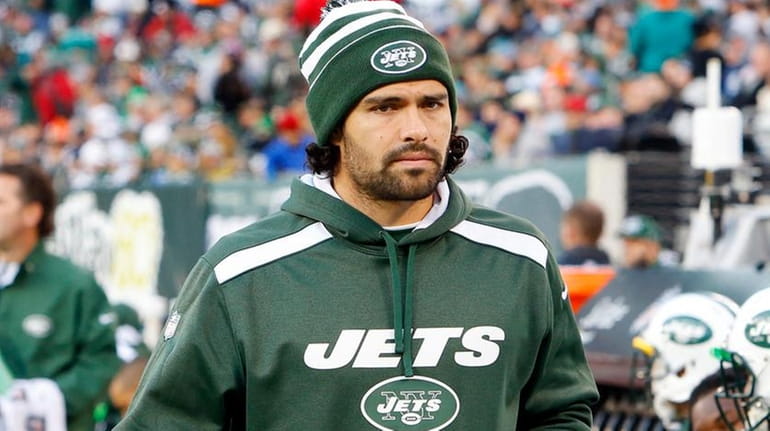 Mark Sanchez of the New York Jets looks on from...