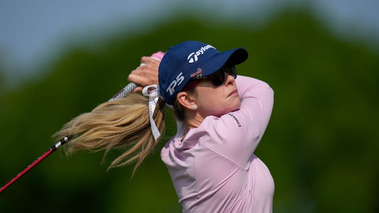 Paula Creamer tees off the third hole during the first...