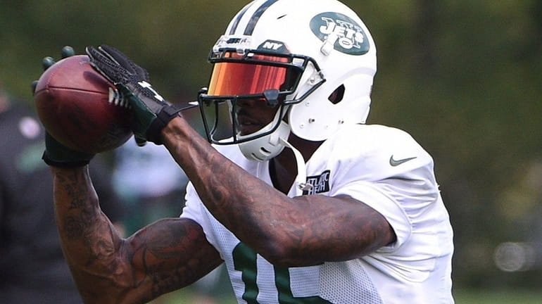 New York Jets wide receiver Brandon Marshall makes the catch...