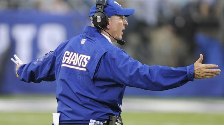 Giants head coach Tom Coughlin reacts during the second half...