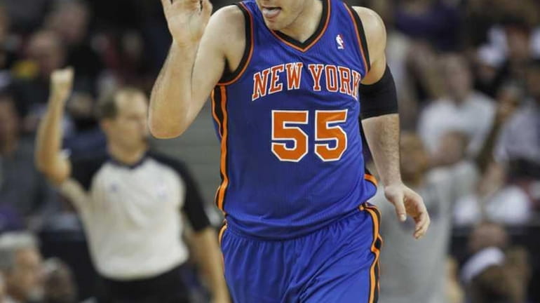 New York Knicks center Josh Harrellson signals his teammates after...