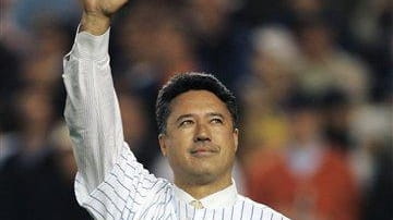 Former New York Mets pitcher Ron Darling waves to the...