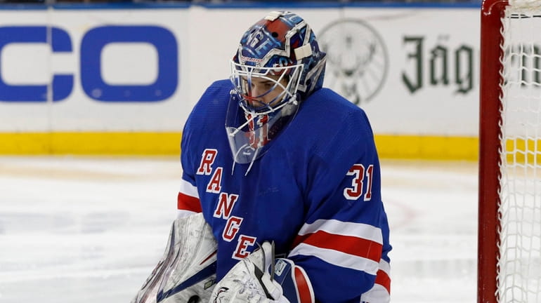 Igor Shesterkin of the Rangers makes a save during the...