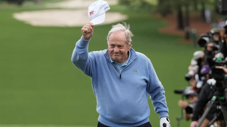 Honorary starter Jack Nicklaus waves as he arrives for his...