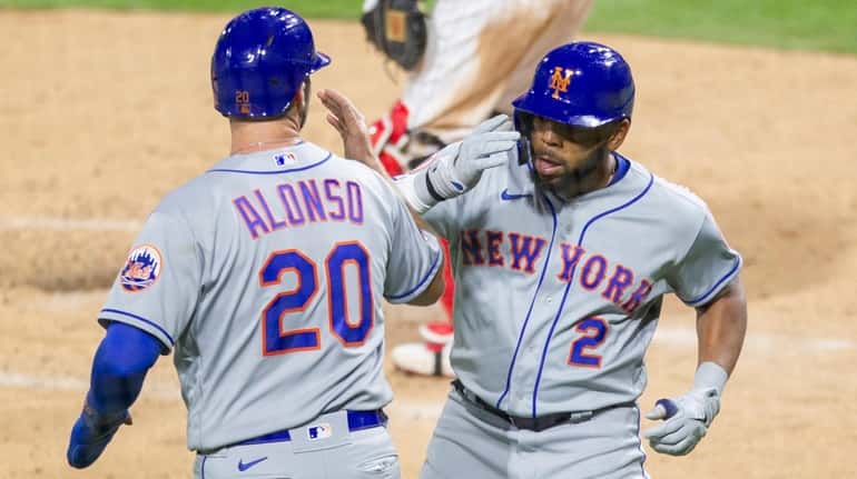 Mets' Dominic Smith celebrates with Pete Alonso after hitting a...