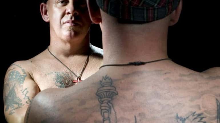 John Feal, a first-responder at Ground Zero, has tattoos that...
