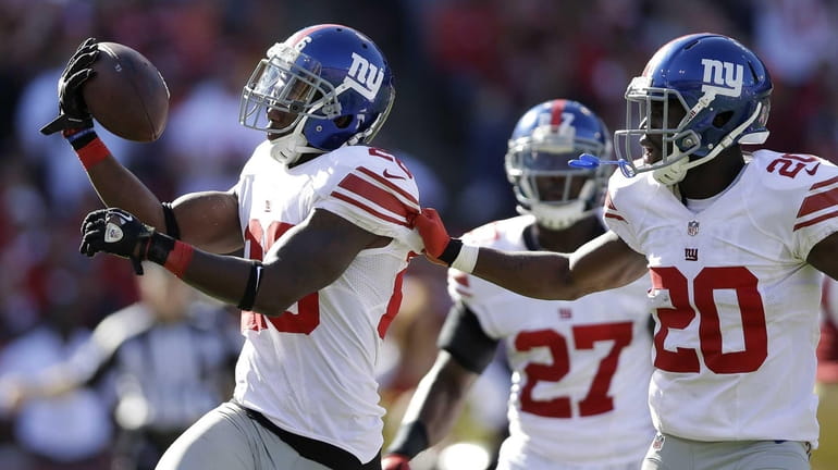 New York Giants free safety Antrel Rolle, left, celebrates with...