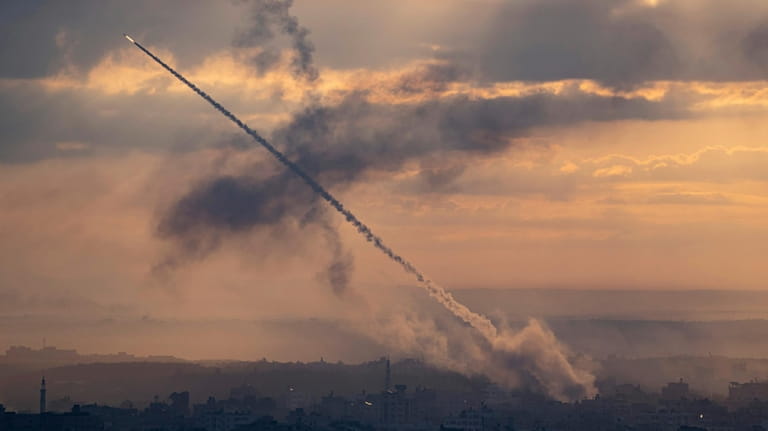 Rockets are fired toward Israel from Gaza on Oct. 7,...