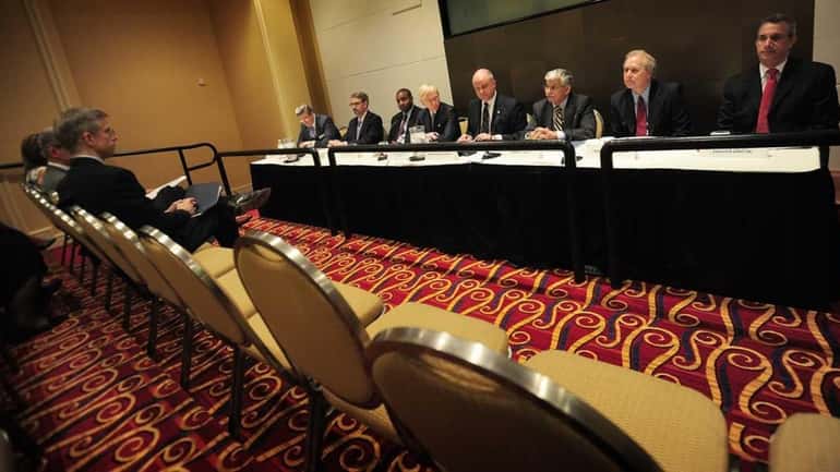 Members of the Nassau County Interim Finance Authority gather for...
